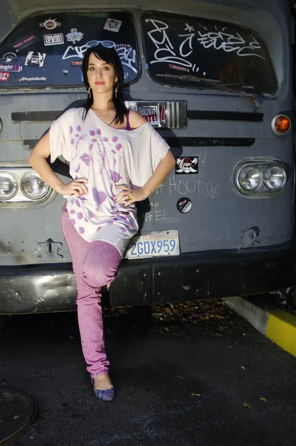 Fashion portrait of a musician beside a customized van